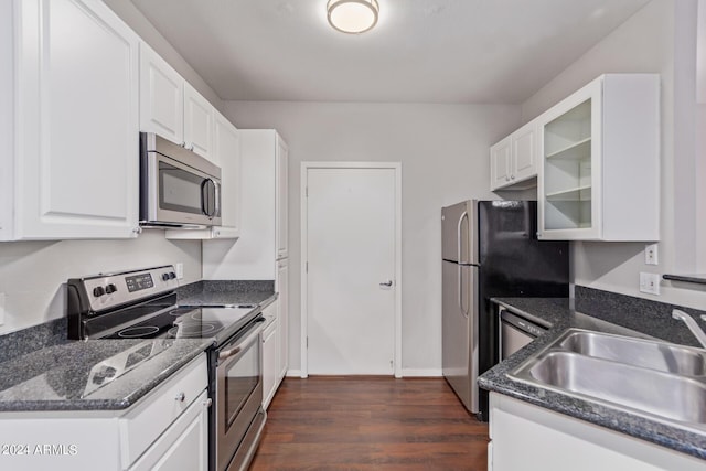 kitchen featuring white cabinets, stainless steel appliances, dark wood-type flooring, and sink