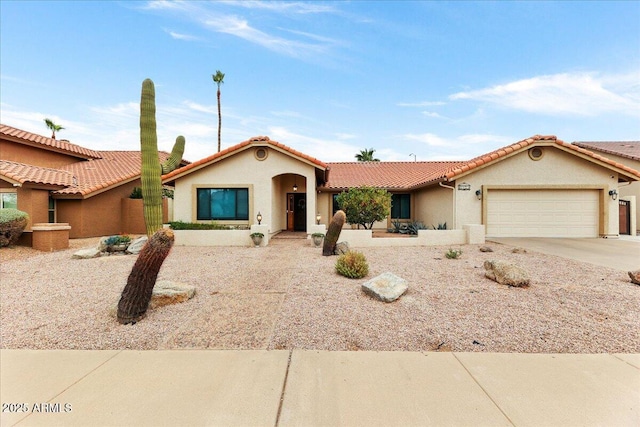 view of front of property featuring a garage, concrete driveway, a tiled roof, and stucco siding