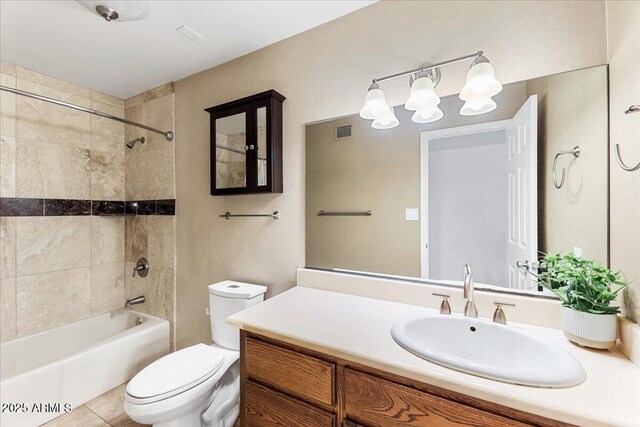 2923 N 63rd St, Mesa, AZ 85215 - full bathroom featuring toilet, vanity, visible vents, shower / washtub combination, and tile patterned floors