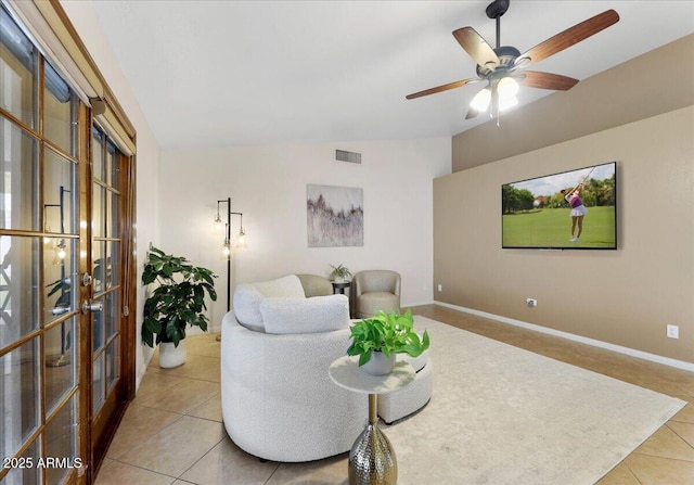 2923 N 63rd St, Mesa, AZ 85215 - living area with visible vents, baseboards, lofted ceiling, ceiling fan, and tile patterned flooring