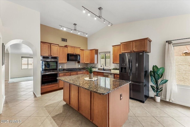 2923 N 63rd St, Mesa, AZ 85215 - kitchen with a kitchen island, a sink, black appliances, and light tile patterned floors