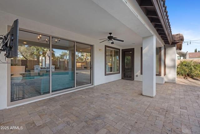 view of patio with a fenced in pool, a ceiling fan, and fence