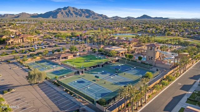 drone / aerial view featuring a residential view and a water and mountain view