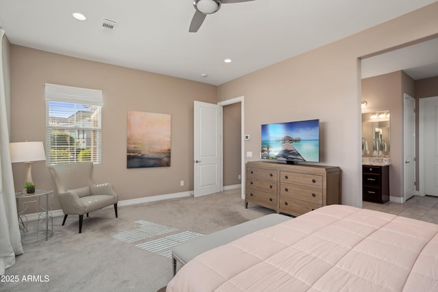 bedroom featuring recessed lighting, light carpet, ensuite bathroom, baseboards, and visible vents