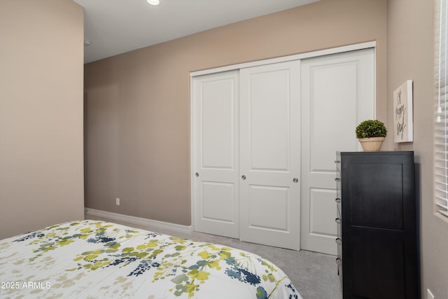 carpeted bedroom with a closet
