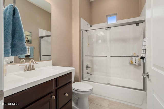 full bathroom featuring combined bath / shower with glass door, toilet, tile patterned flooring, and vanity