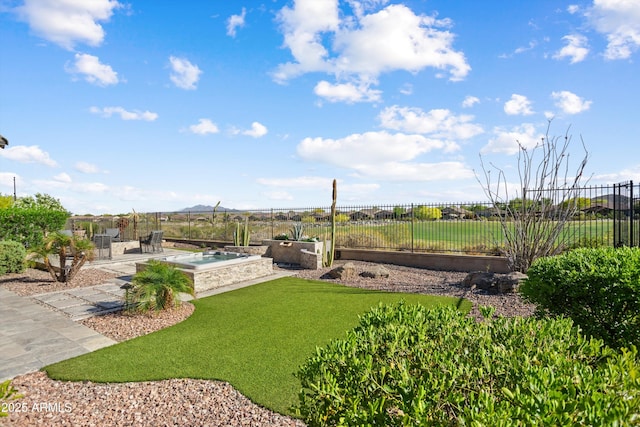 view of yard featuring a patio and fence