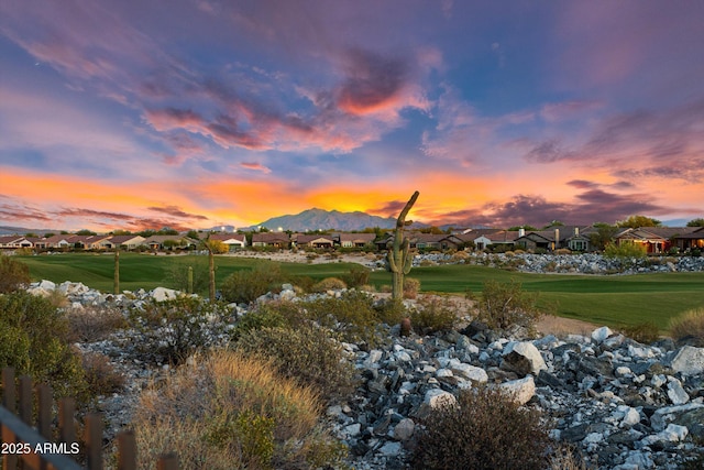 property view of mountains with golf course view and a residential view