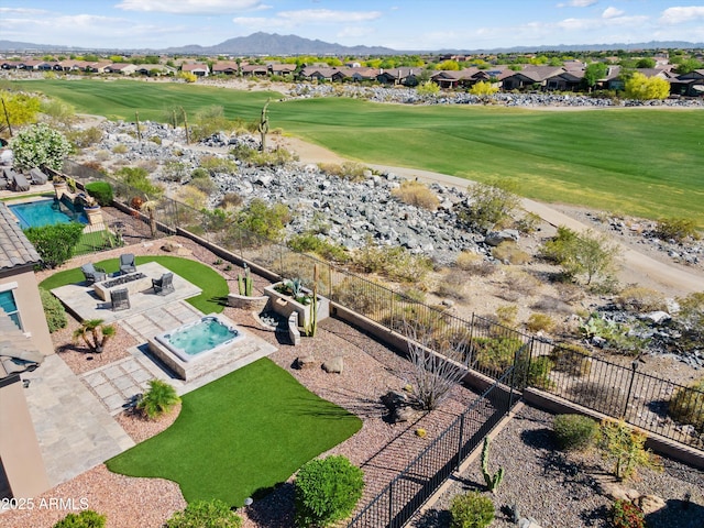 bird's eye view with a residential view, a mountain view, and view of golf course