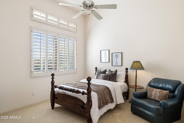 bedroom featuring ceiling fan and carpet floors