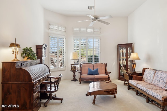 sitting room featuring ceiling fan, carpet, and visible vents