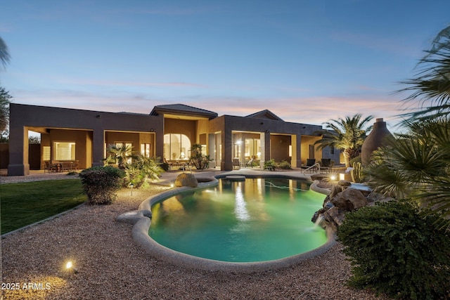 outdoor pool with a patio area