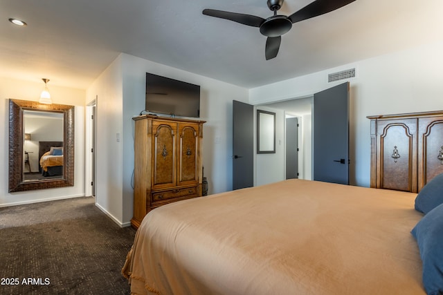 bedroom featuring dark carpet and ceiling fan