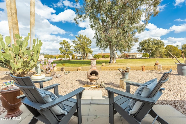 view of patio with a fire pit