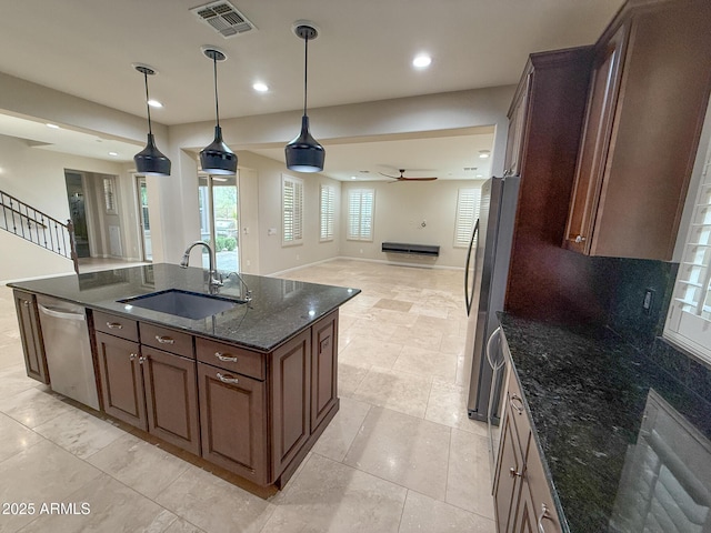 18515 N 94th St, Scottsdale, AZ 85255 - kitchen featuring a ceiling fan, a sink, open floor plan, appliances with stainless steel finishes, and visible vents