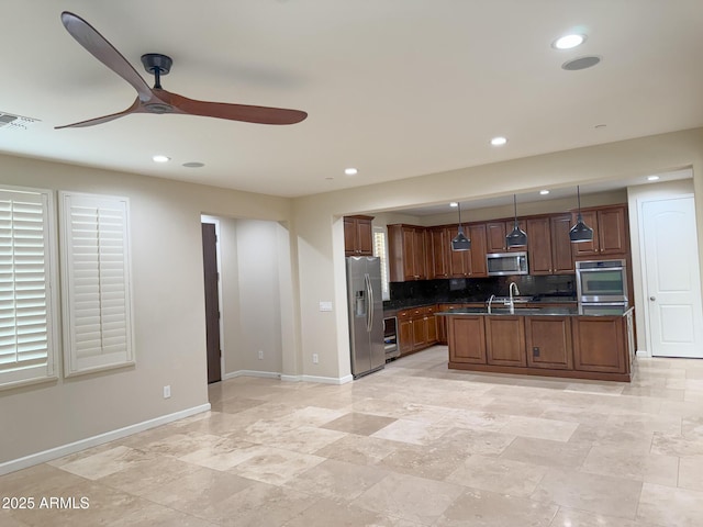 18515 N 94th St, Scottsdale, AZ 85255 - kitchen with dark countertops, a ceiling fan, appliances with stainless steel finishes, visible vents, and recessed lighting