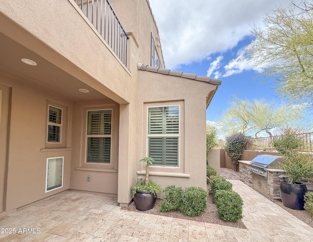 18515 N 94th St, Scottsdale, AZ 85255 - view of side of property featuring stucco siding, fence, a patio area, and area for grilling