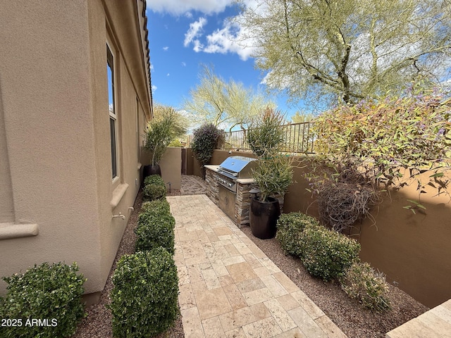 18515 N 94th St, Scottsdale, AZ 85255 - view of patio / terrace featuring exterior kitchen, area for grilling, and a fenced backyard