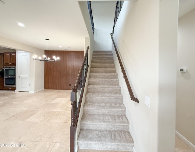 18515 N 94th St, Scottsdale, AZ 85255 - stairs featuring a chandelier, wood walls, baseboards, and recessed lighting