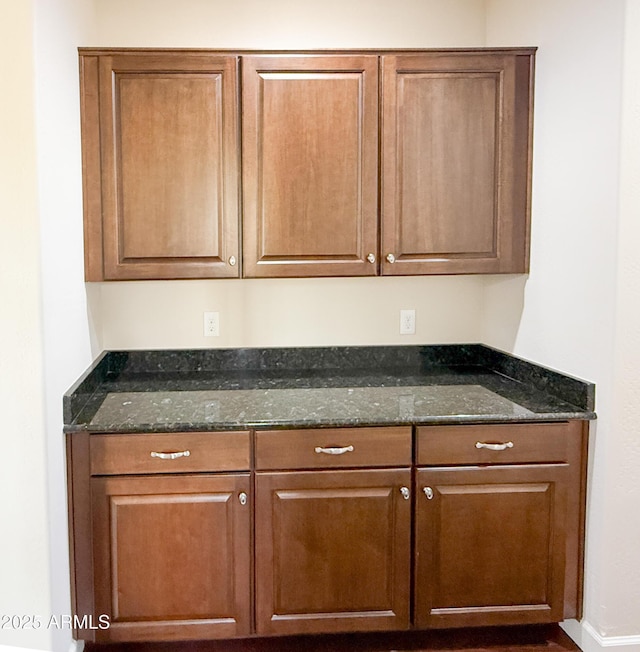 18515 N 94th St, Scottsdale, AZ 85255 - interior space featuring brown cabinetry and dark stone countertops