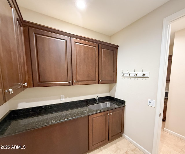 18515 N 94th St, Scottsdale, AZ 85255 - laundry area featuring baseboards, a sink, and light tile patterned floors