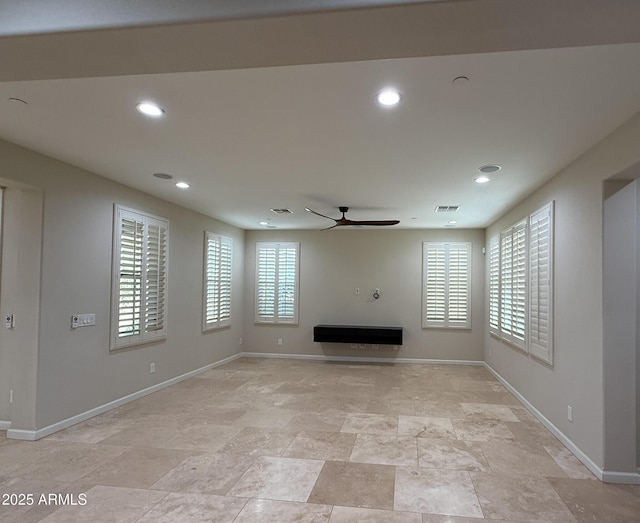 18515 N 94th St, Scottsdale, AZ 85255 - unfurnished living room with a ceiling fan, baseboards, stone finish flooring, and recessed lighting
