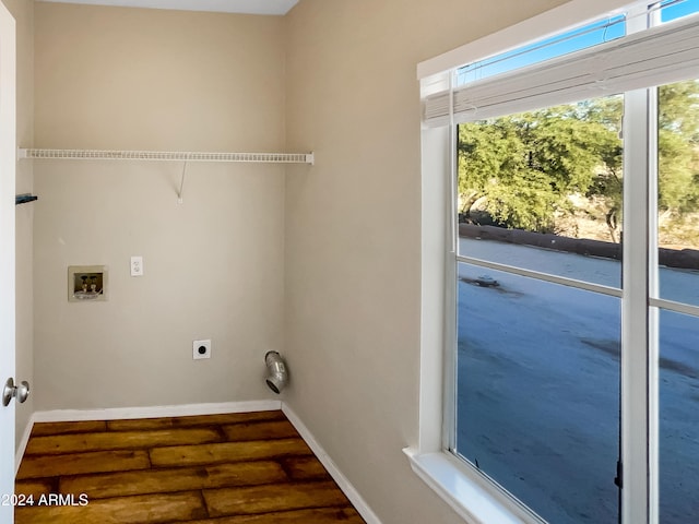 washroom with hookup for an electric dryer, dark hardwood / wood-style floors, and hookup for a washing machine