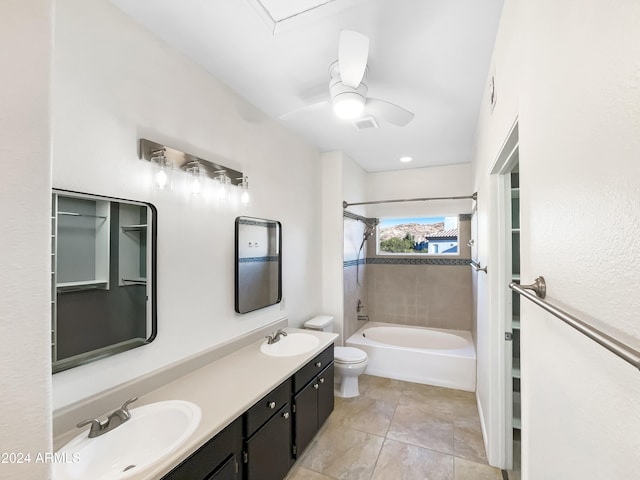 full bathroom featuring tile patterned floors, vanity, ceiling fan, toilet, and tiled shower / bath