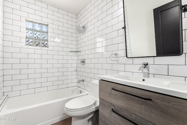 full bathroom featuring vanity, toilet, tile walls, washtub / shower combination, and backsplash