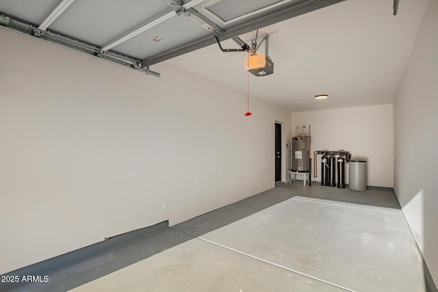 garage with a garage door opener and electric water heater