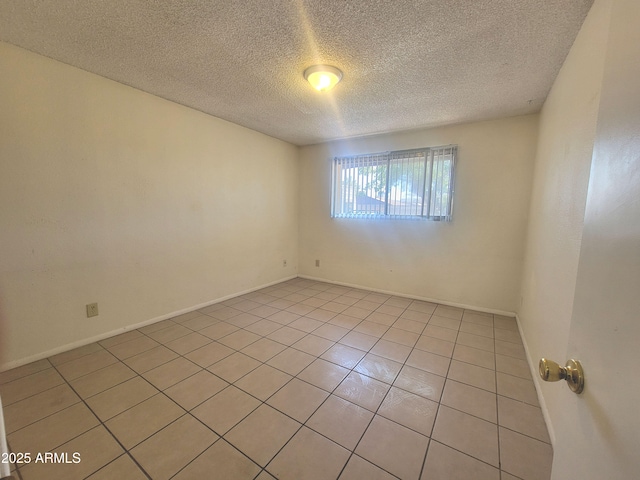 15602 N 55th Ave, Glendale, AZ 85306 - unfurnished room with a textured ceiling and light tile patterned floors