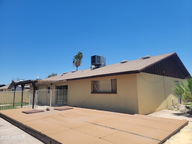 15602 N 55th Ave, Glendale, AZ 85306 - rear view of property featuring a patio area and board and batten siding