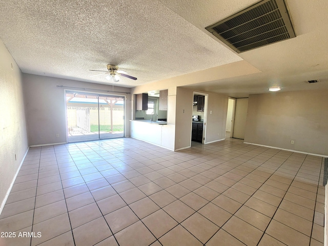 15602 N 55th Ave, Glendale, AZ 85306 - unfurnished room with a ceiling fan, light tile patterned flooring, and a textured ceiling