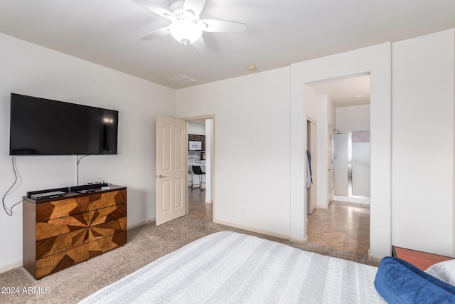 bedroom with light carpet and ceiling fan