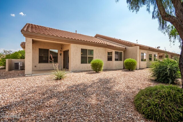 back of house featuring central AC and a patio