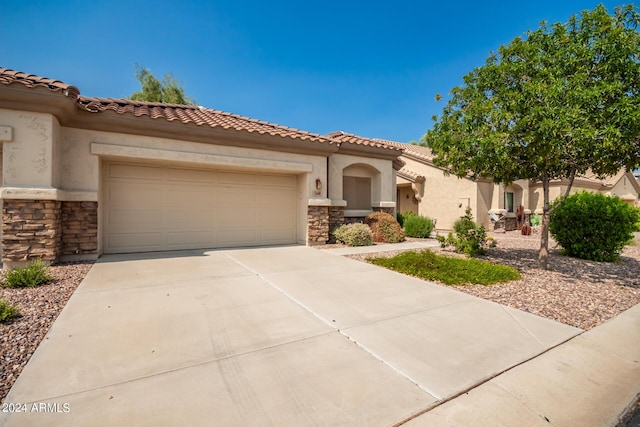 mediterranean / spanish-style house featuring a garage