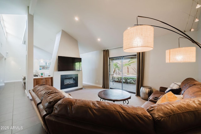 living area featuring a glass covered fireplace, recessed lighting, high vaulted ceiling, and baseboards