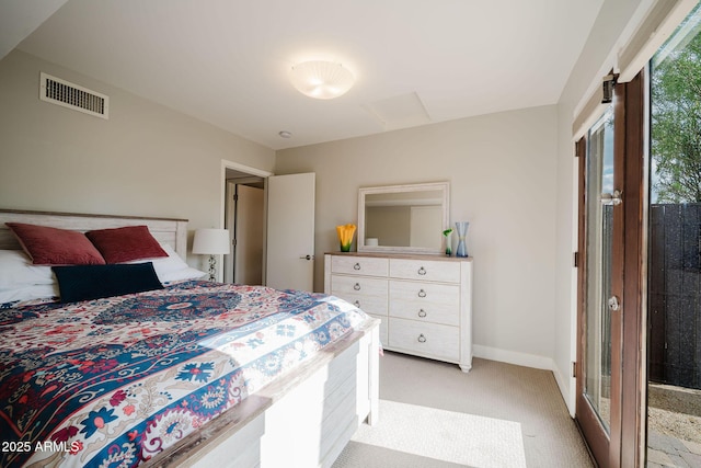 bedroom with light colored carpet, visible vents, and baseboards