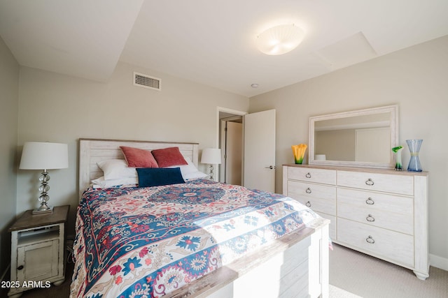 carpeted bedroom with visible vents