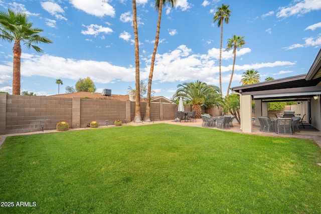 view of yard with a fenced backyard and a patio area