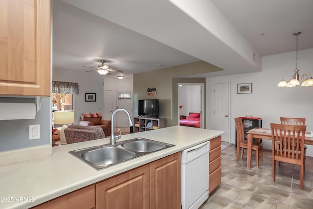 kitchen with ceiling fan with notable chandelier, decorative light fixtures, light brown cabinetry, sink, and white dishwasher