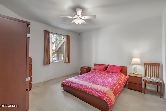 bedroom featuring light carpet and ceiling fan