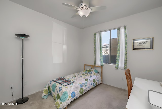 bedroom with ceiling fan and light colored carpet