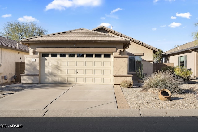 view of front of property with a garage