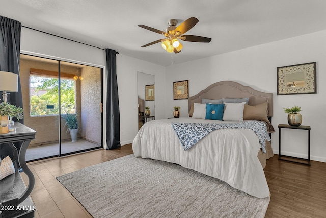 bedroom featuring ceiling fan, access to exterior, and wood-type flooring