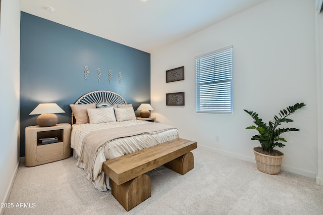 bedroom with baseboards and carpet flooring