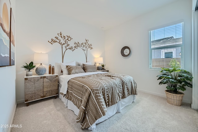 carpeted bedroom with baseboards