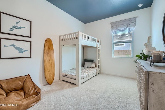 carpeted bedroom featuring baseboards