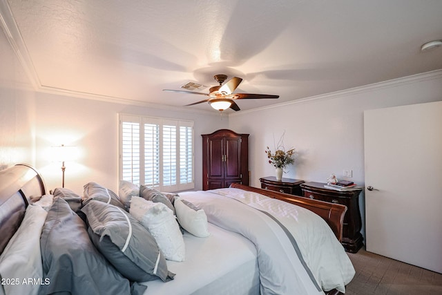 bedroom with ceiling fan and ornamental molding