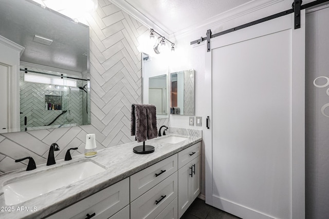 bathroom with vanity, crown molding, and tasteful backsplash